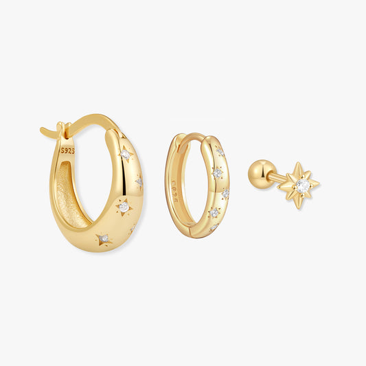 Gold hoop earrings with star designs on a white background