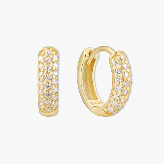 Gold hoop earrings with diamond accents on a white background