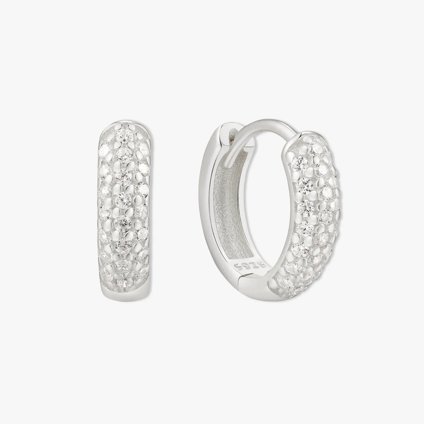 Silver hoop earrings with embedded stones on a white background