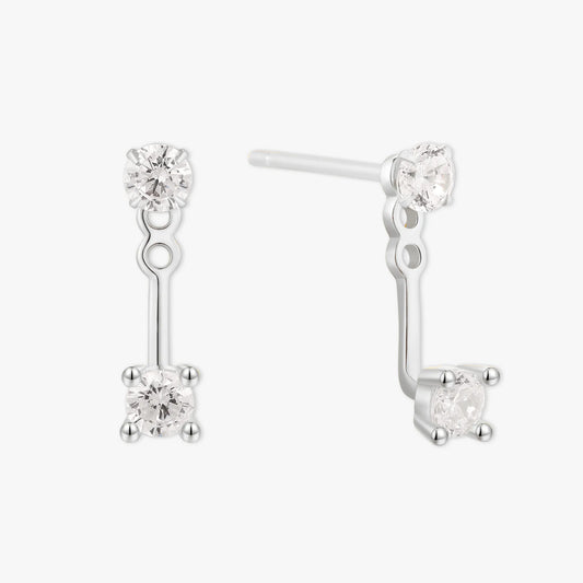 Pair of silver earrings with clear gemstones on a white background