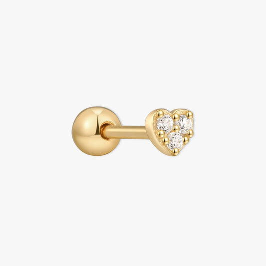 Gold earring with heart-shaped gem on a white background