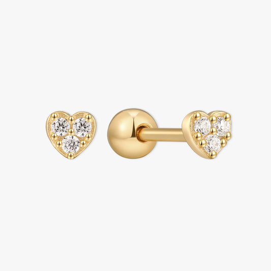Gold heart-shaped earrings with clear gemstones on a white background