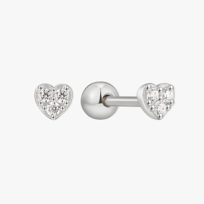 Heart-shaped silver earrings with clear gemstones on a white background