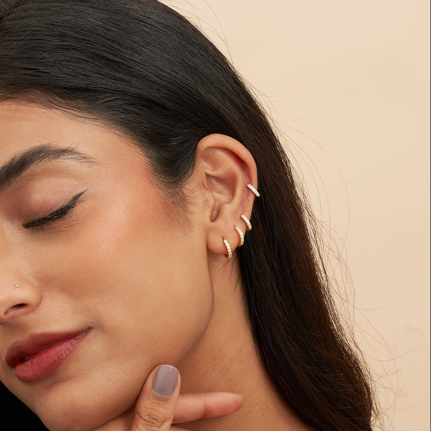 Crystal Paved Huggie Hoops In Gold - LÉA