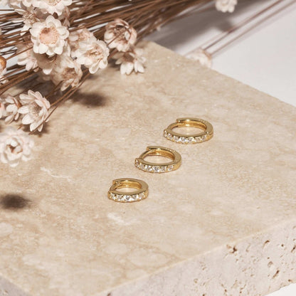 Crystal Paved Huggie Hoops In Gold - LÉA