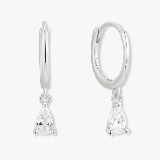 Silver hoop earrings with teardrop-shaped gemstones on a white background