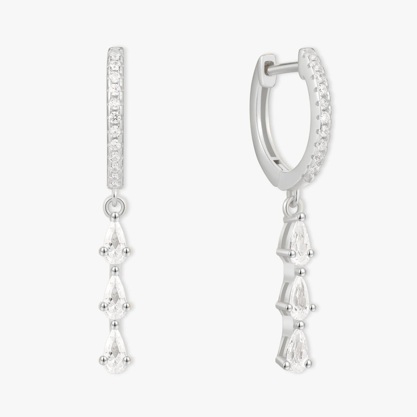 Silver hoop earrings with teardrop-shaped gemstones on a white background