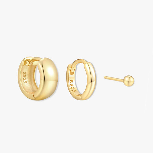 Gold hoop earrings on a white background