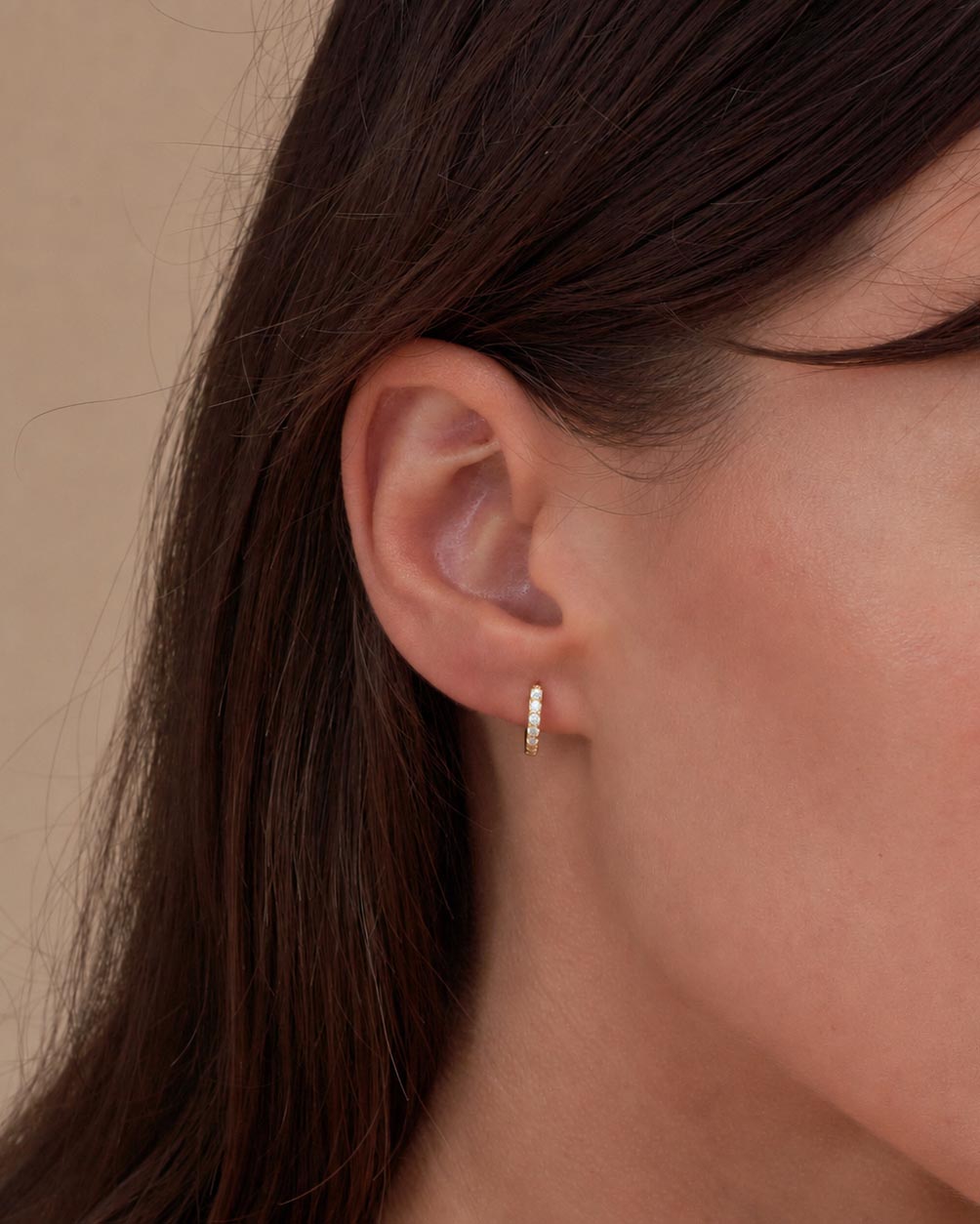 Crystal Paved Huggie Hoops In Gold