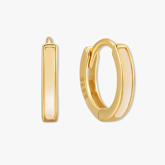 Gold hoop earrings on a white background