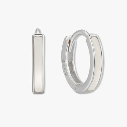 Silver hoop earrings on a white background