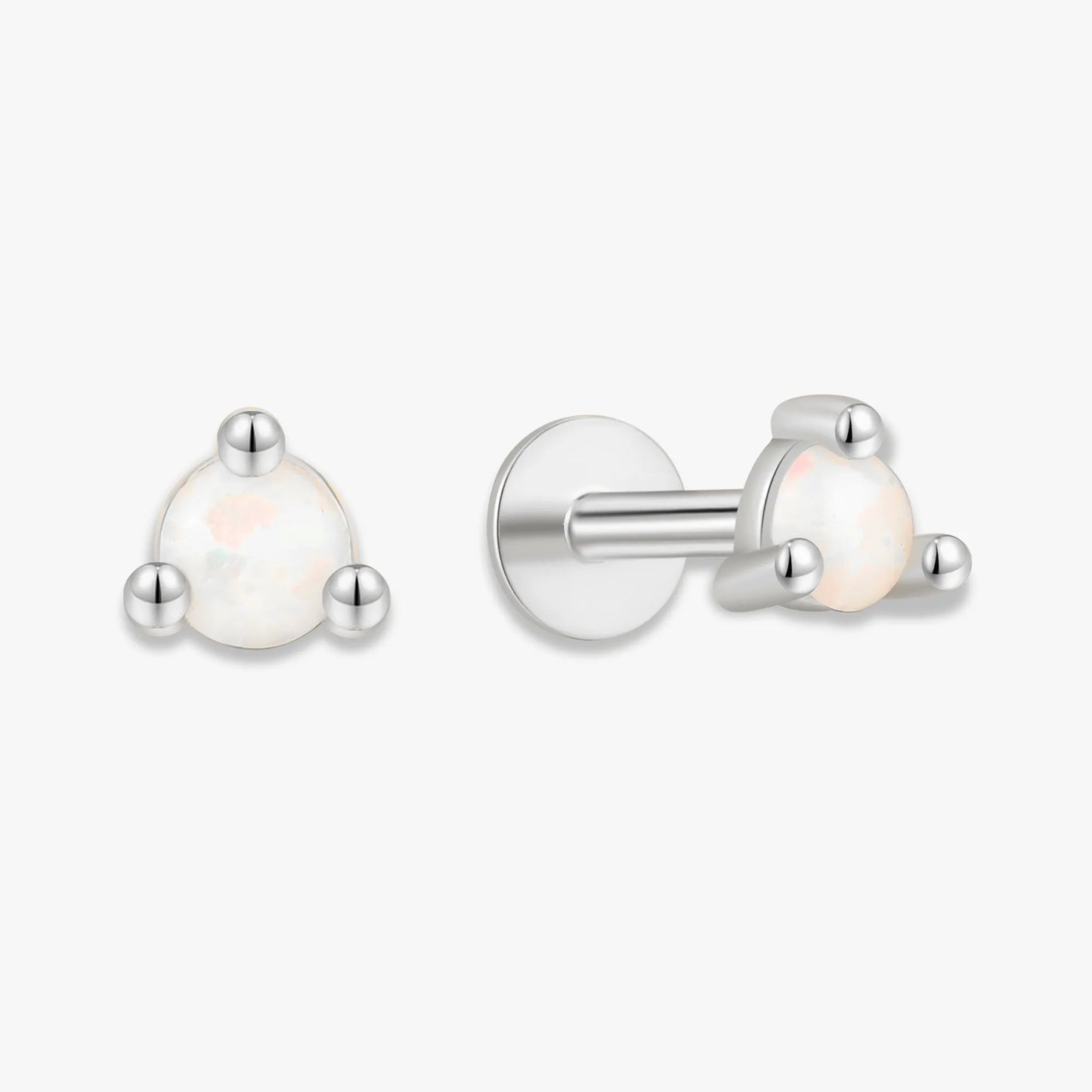 Pair of silver earrings with white gemstones on a white background