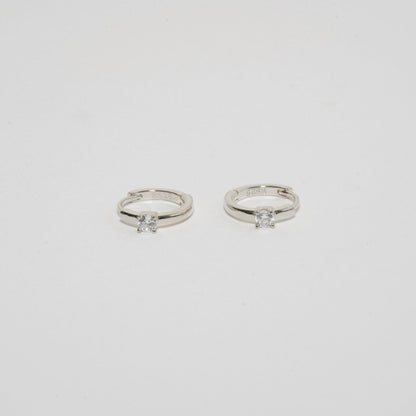 Solitaire Crystal Huggie Hoops In Silver - LÉA