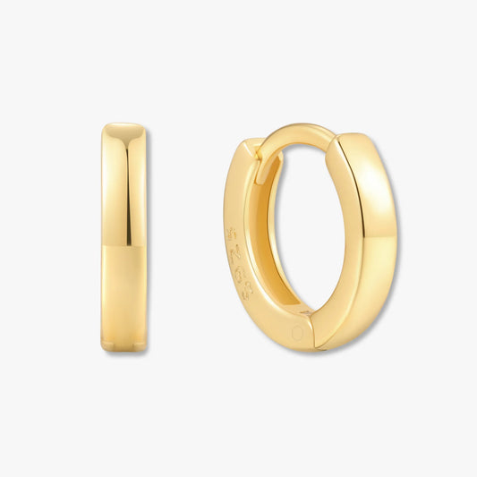 Gold hoop earrings on a white background