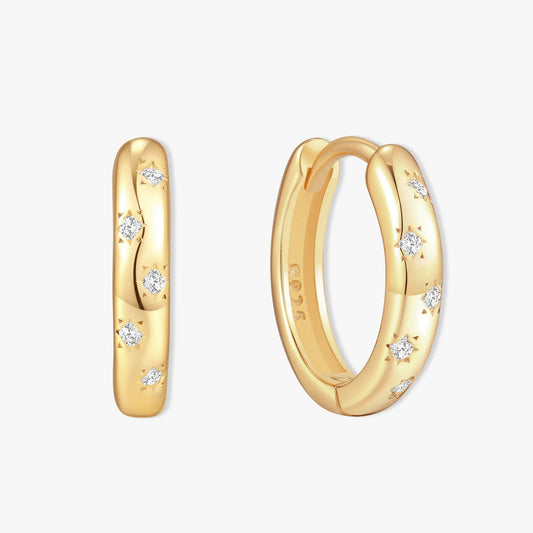 Gold hoop earrings with diamond accents on a white background