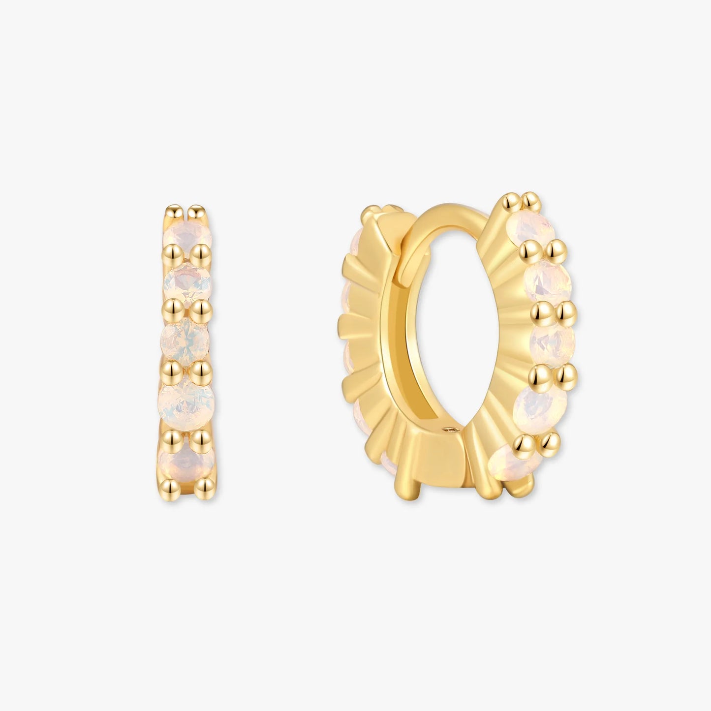 Gold hoop earrings with opal stones on a white background