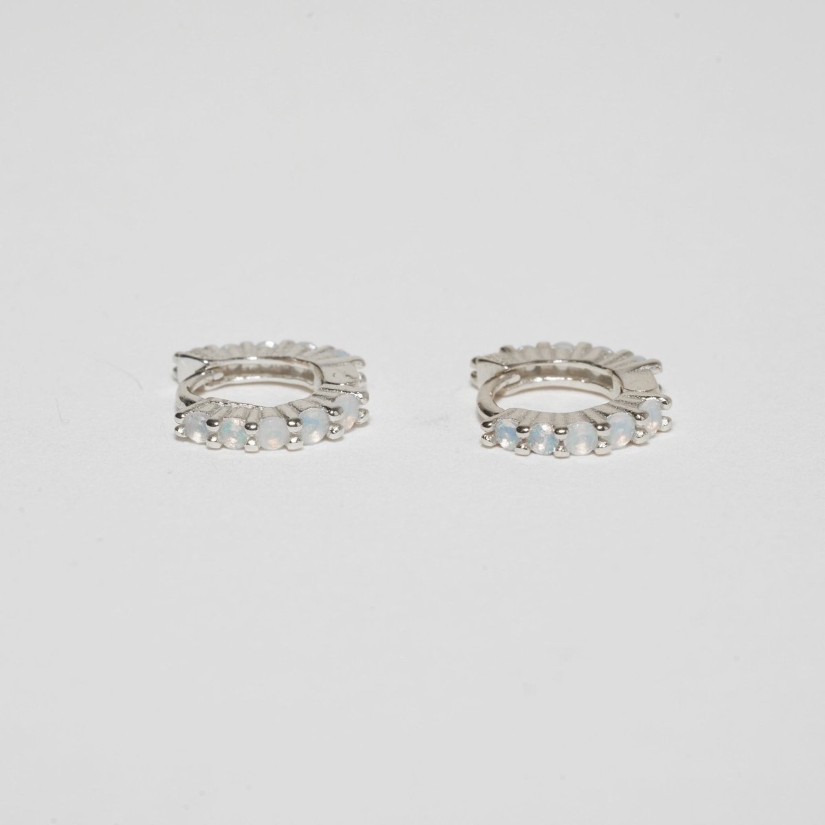White Opal Huggie Hoops In Silver - LÉA